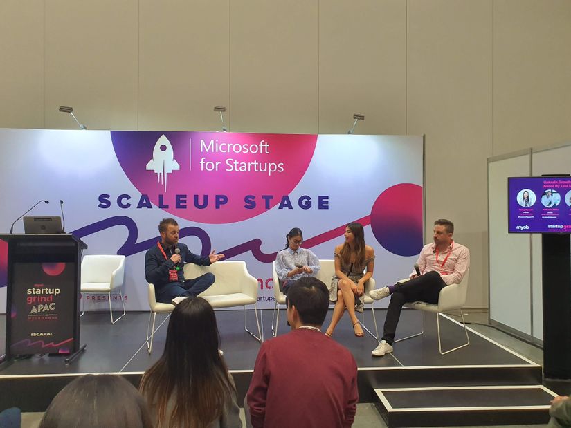 String Nguyen, Nathaniel Bibby, Lisa Teh and Tobi Skovron presenting on the Microsoft Scaleup
Stage